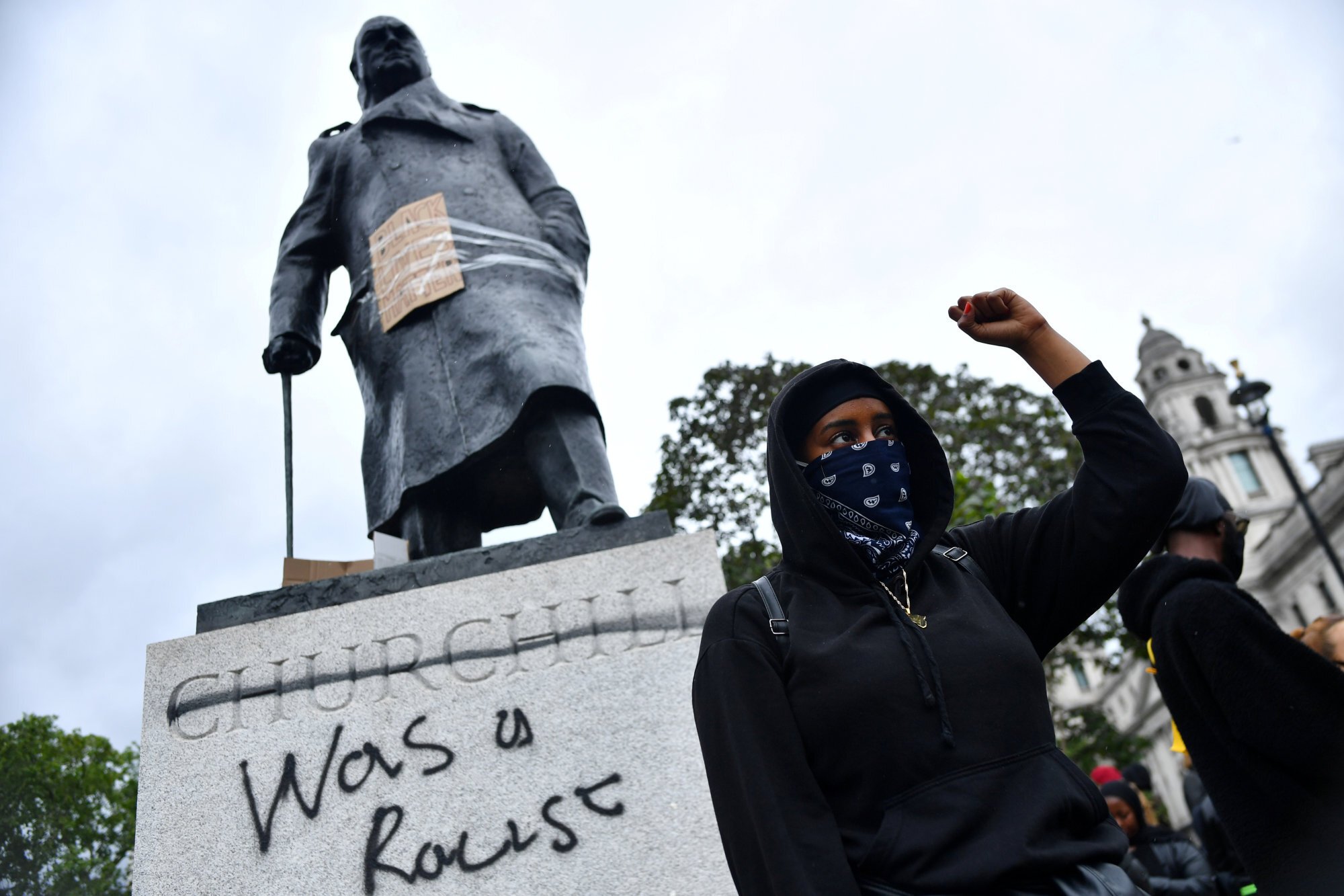 Graffiti on a statue of Winston Churchill in Parliament Square, London, during a Black Lives Matter protest. Photo: Reuters